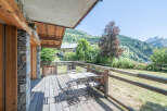 Enjoy breathtaking mountain views from this charming balcony.