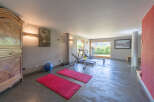 This spacious home gym offers a perfect blend of fitness and relaxation.