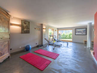 This spacious home gym offers a perfect blend of fitness and relaxation.