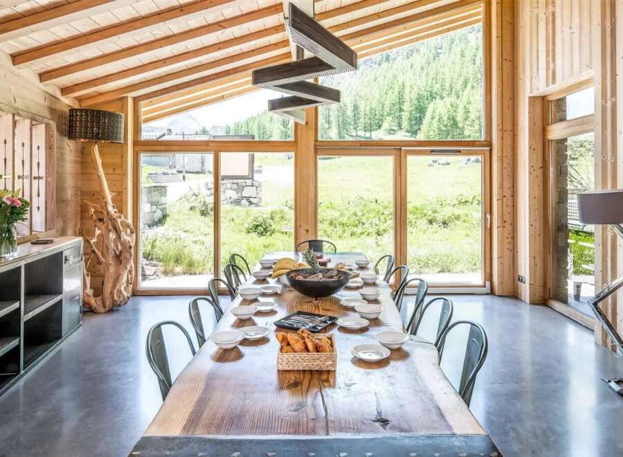 This stunning dining room boasts a rustic yet modern design, perfect for entertaining.