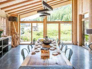 This stunning dining room boasts a rustic yet modern design, perfect for entertaining.