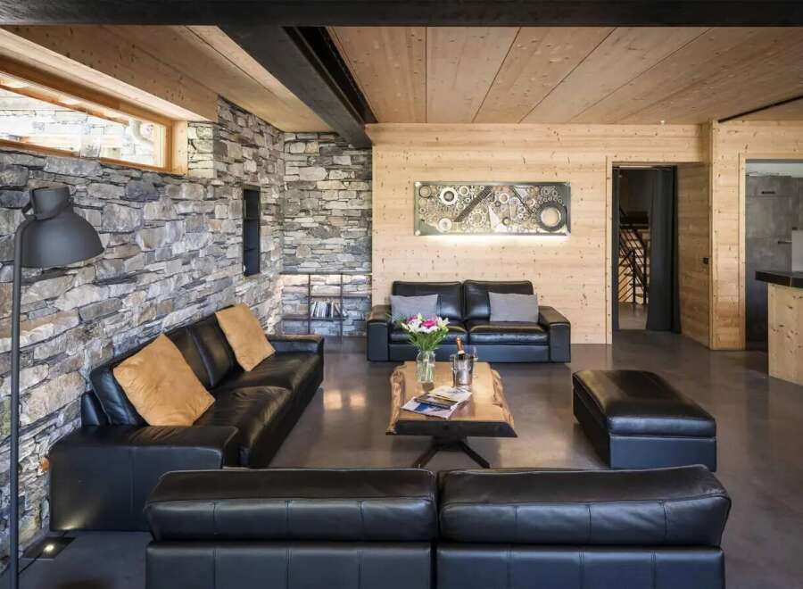 Experience luxury living in this stunning property, featuring a modern interior design with a rustic touch.