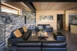 Experience luxury living in this stunning property, featuring a modern interior design with a rustic touch.