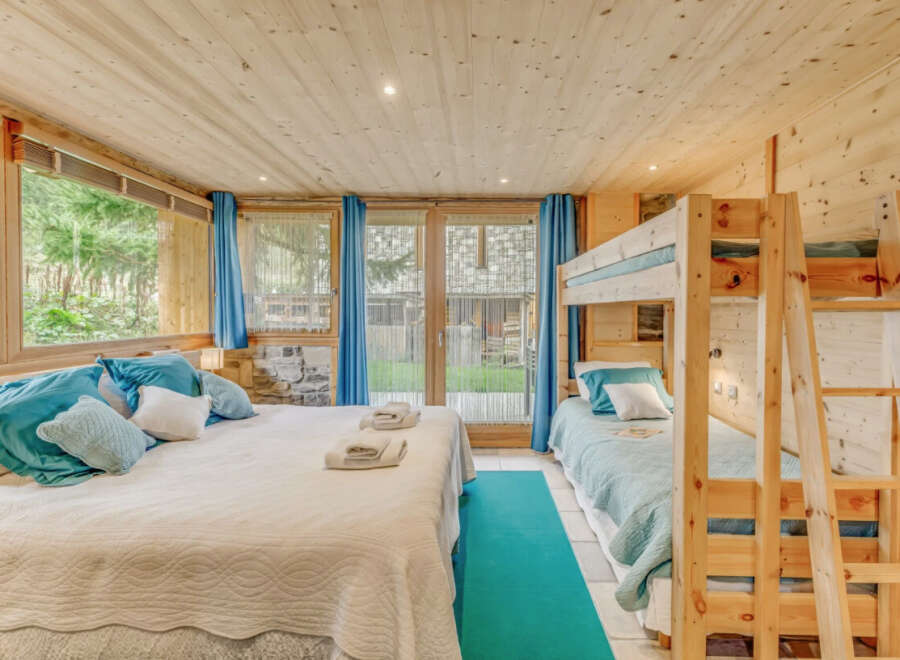 Discover the charm of this cozy bedroom, perfect for a family getaway.