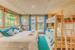 Discover the charm of this cozy bedroom, perfect for a family getaway.