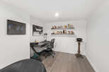 Step into this stylish home office, featuring a sleek desk and comfortable chair, perfect for productivity.