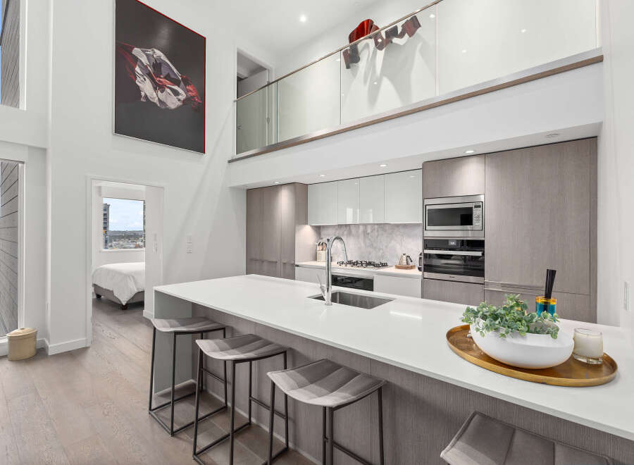 Experience luxury living in this stunning modern kitchen.