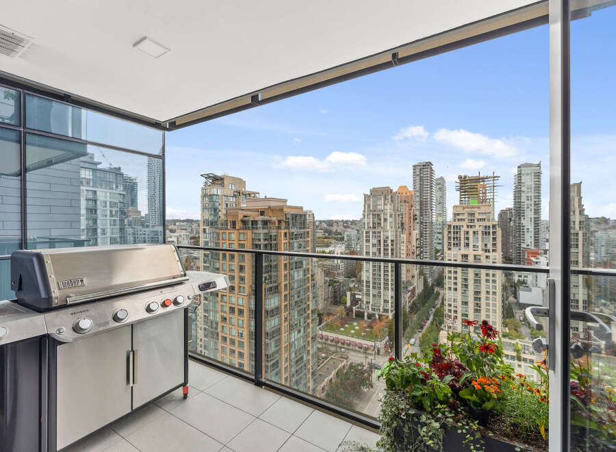 Enjoy breathtaking city views from this stunning high-rise balcony.