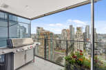 Enjoy breathtaking city views from this stunning high-rise balcony.