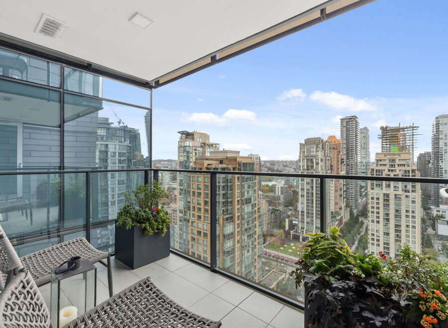 Enjoy breathtaking city views from this stunning balcony.