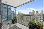 Enjoy breathtaking city views from this stunning balcony.