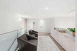 Step into modern elegance with this stunning property, featuring a bright and airy interior.