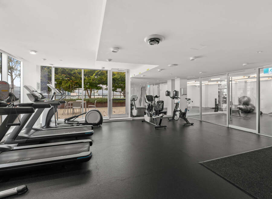 This modern fitness center offers a bright and spacious environment for your workout routine.