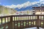 Enjoy breathtaking mountain views from this charming property.