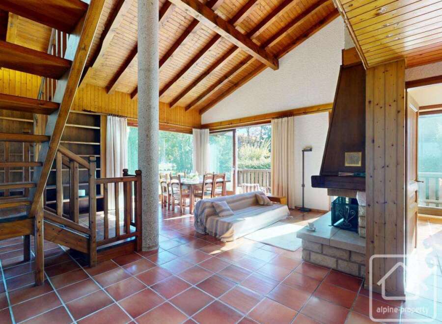 This stunning property boasts a warm and inviting interior with a rustic charm.