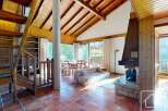 This stunning property boasts a warm and inviting interior with a rustic charm.