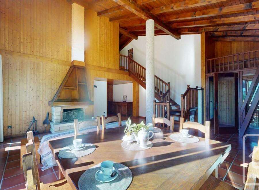 Experience the charm of this stunning property, featuring a cozy fireplace and a spacious dining area perfect for gatherings.