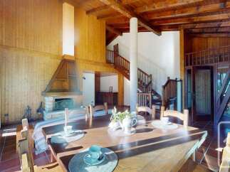 Experience the charm of this stunning property, featuring a cozy fireplace and a spacious dining area perfect for gatherings.