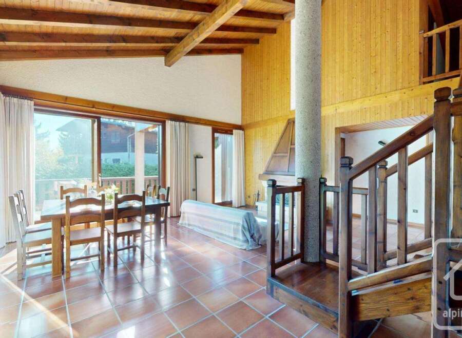 Discover the charm of this stunning property, featuring a spacious living area with a cozy fireplace and a beautiful dining space.