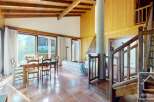 Discover the charm of this stunning property, featuring a spacious living area with a cozy fireplace and a beautiful dining space.