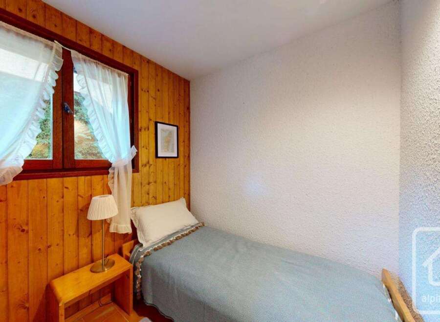 Discover a cozy single bedroom retreat, perfect for a peaceful getaway.