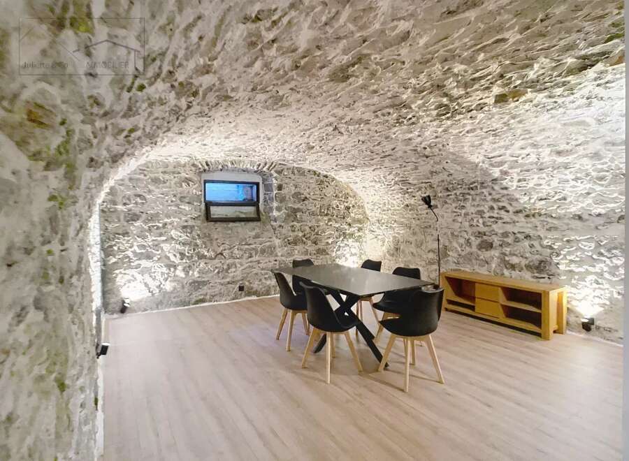 Discover the unique charm of this property, featuring a stunning stone-walled interior.