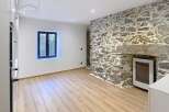 Discover the charm of this unique property featuring a stunning stone wall that adds character and warmth to the space.