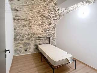 Discover the charm of this unique property featuring exposed stone walls and a cozy atmosphere.