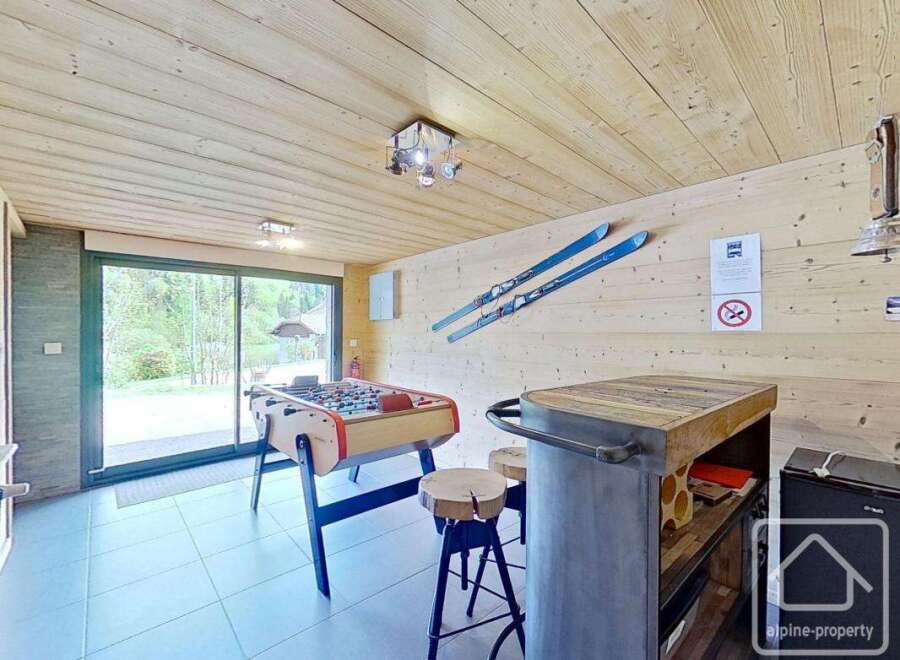 This stunning property boasts a unique entertainment space, perfect for relaxation and fun.