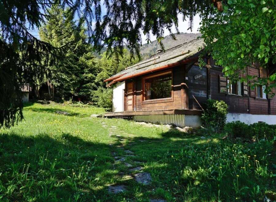 Nestled in a serene natural setting, this charming wooden cabin offers a perfect blend of rustic charm and modern comfort.