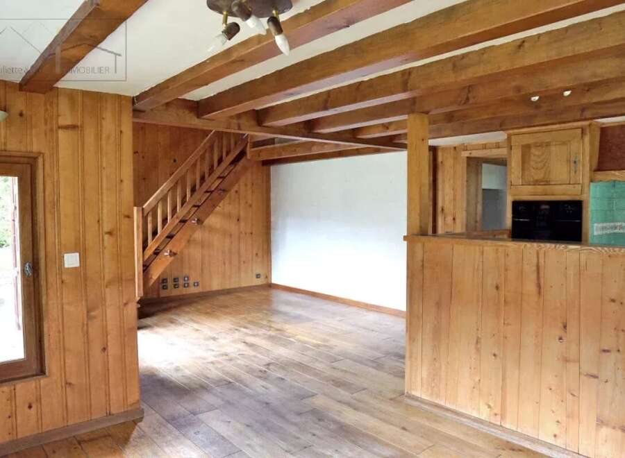 Discover the charm of this inviting property, featuring warm wooden accents throughout.