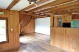 Discover the charm of this inviting property, featuring warm wooden accents throughout.