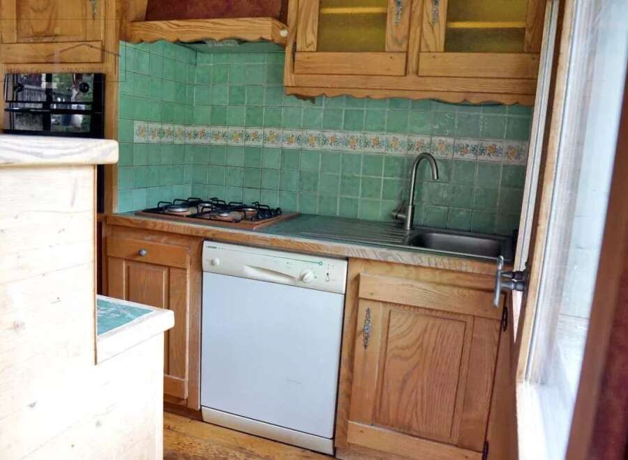 Discover the charm of this cozy kitchen, perfect for culinary adventures.