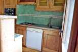 Discover the charm of this cozy kitchen, perfect for culinary adventures.