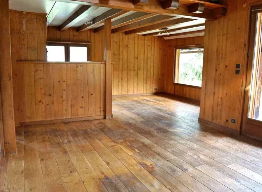 Step into this inviting space with its warm wooden accents and natural light.