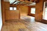 Step into this inviting space with its warm wooden accents and natural light.