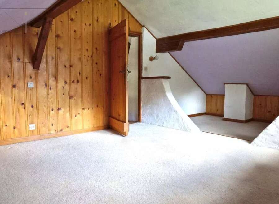 Discover the charm of this unique property featuring a cozy interior with wooden paneling and a bright, airy atmosphere.