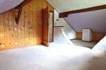 Discover the charm of this unique property featuring a cozy interior with wooden paneling and a bright, airy atmosphere.