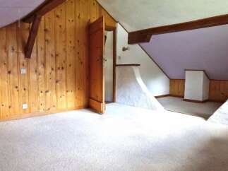 Discover the charm of this unique property featuring a cozy interior with wooden paneling and a bright, airy atmosphere.