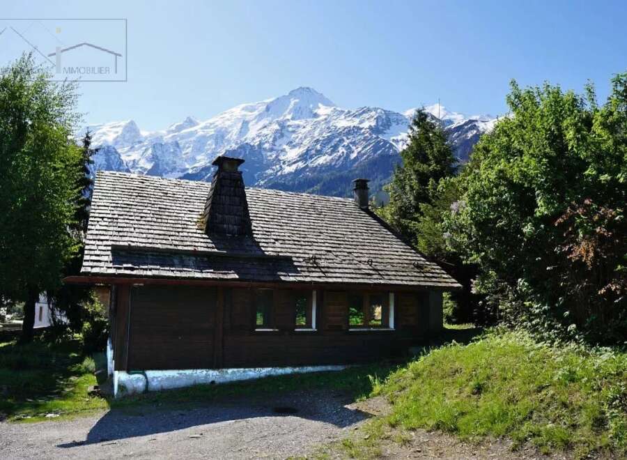 Nestled amidst the breathtaking backdrop of snow-capped mountains, this charming wooden cabin offers a serene escape.