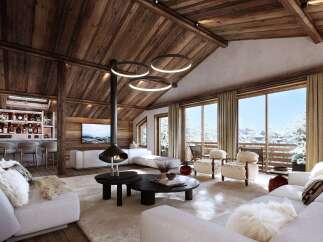 Experience luxury living in this stunning chalet, featuring a cozy fireplace and a modern open-plan design.