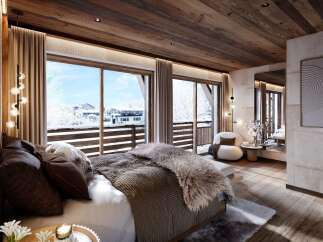 Experience the epitome of luxury in this stunning bedroom, boasting breathtaking views of a snow-covered landscape.