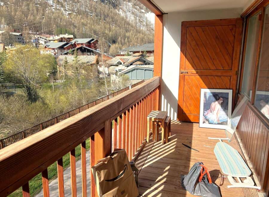Enjoy breathtaking mountain views from this charming balcony.