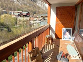 Enjoy breathtaking mountain views from this charming balcony.