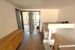 Discover this bright and airy property featuring a stylish wooden floor and a modern design.