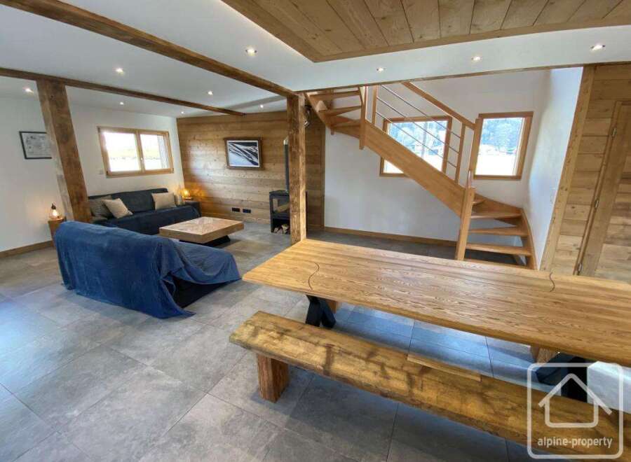 Discover the charm of this stunning property, featuring a cozy living area with a comfortable sofa and a stylish coffee table.