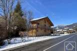 Discover this stunning wooden chalet nestled in a picturesque mountain setting.