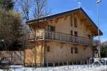 Discover this stunning wooden chalet, a perfect blend of rustic charm and modern design.