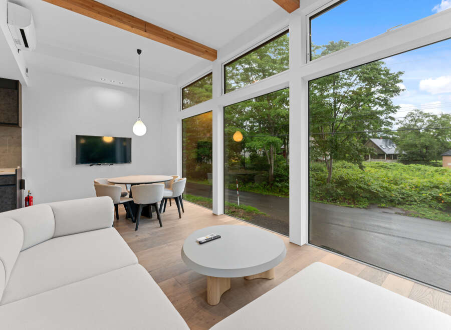 Experience modern living in this stunning property, featuring expansive windows that flood the space with natural light and offer breathtaking views.