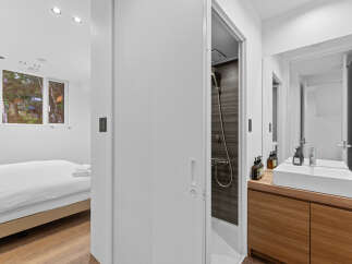 This modern property boasts a sleek bathroom design with a spacious shower and a stylish vanity.